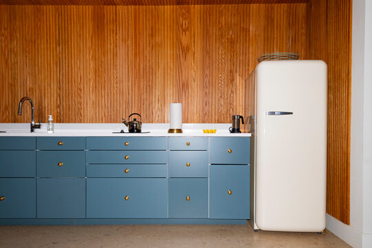 Vertical wood Paneling  kitchen refrigerator nobody