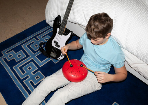 Teenager musician drum bedroom dusk