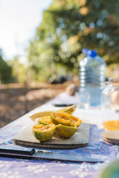 Fresh lemon halves, for an outdoor drink.