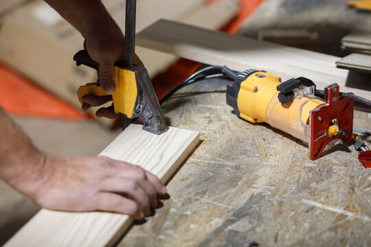 Man prepares plank for milling 