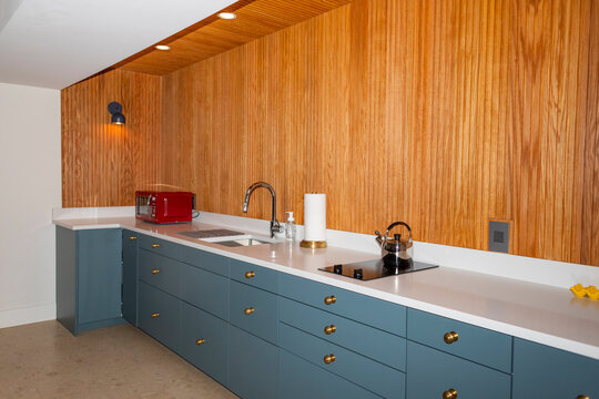 Vertical wood Paneling modern  kitchen counter nobody apartment 