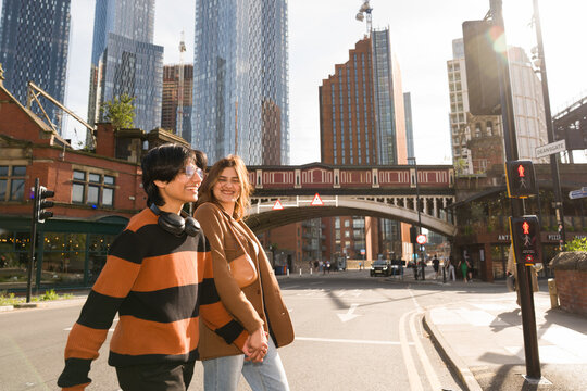 Couple Crossing Street At Manchester, UK