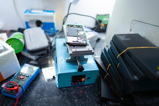 Electronics repair tools and devices on desk