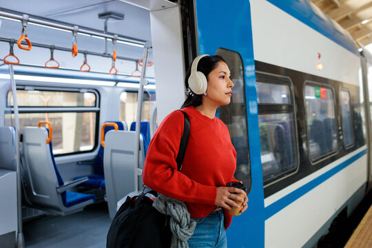 Woman exiting a passenger train