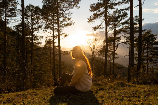 Woman forest sunset 