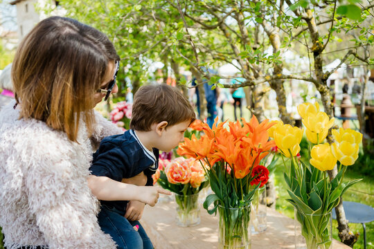 A woman with her toddler is enjoying a spring day together