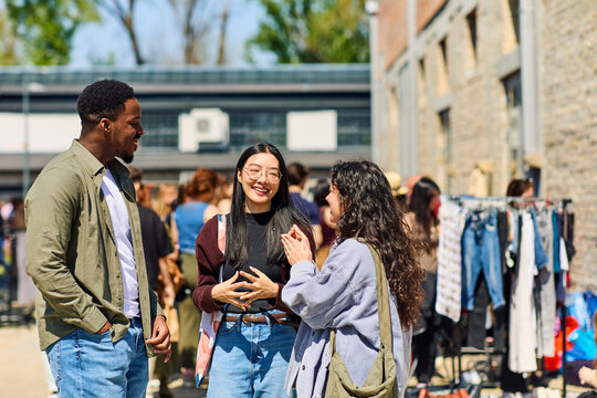 People Socializing at a Market in a City on a Sunny Day