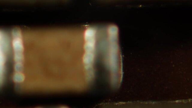 Microscope Macro Close-up Shot of Microchip, CPU Processor on Printed Circuit Board, Computer Motherboard with Components Inside of Electronic Device, Part of Supercomputer microscop.