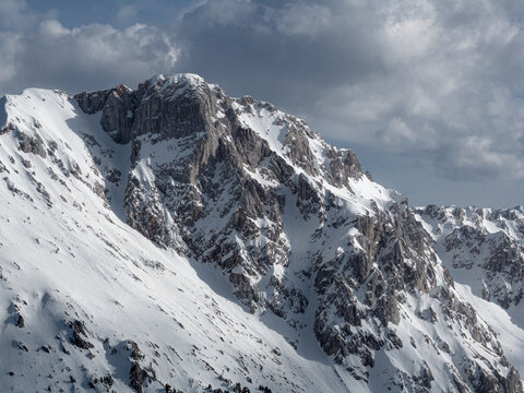 Mountain Landscape Shows Snowy Roslyn Peaks Under a Cloudy Sky