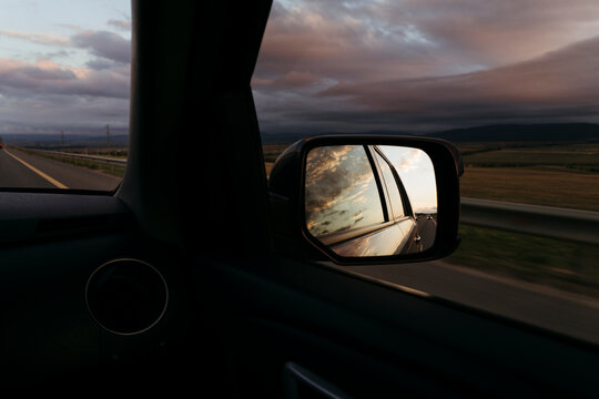 Journey Along the Open Road With Golden Reflections at Sunset