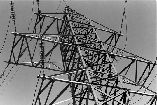 B&W Film Photo &ndash; Electricity Pylon Steel Structure from Below