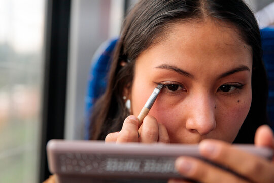 Close up of applying makeup on the go