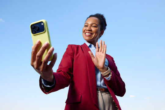 Woman sends greetings via her phone