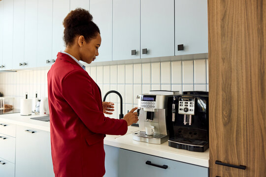 Woman prepares espresso