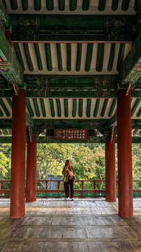 Woman in traditional pavilion in Jeonju