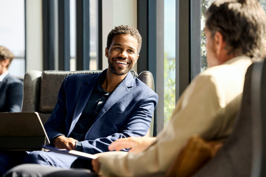 Business Executives Meet in Hotel Lounge