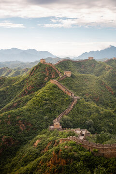 The Great Wall of China winding through wild mountains