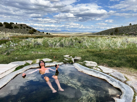 Man Soaking in Natural Hot Spring 
