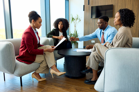 Woman reviews contract documents before signing