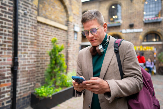 Tourist using navigation on smartphone