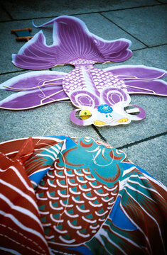 Colorful Fish Kites on the the Ground During a Festival