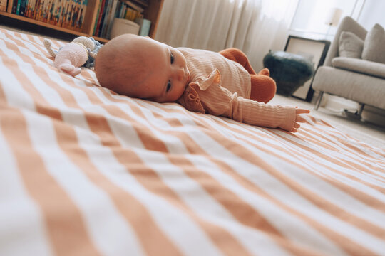 Baby learning to turn on tummy 