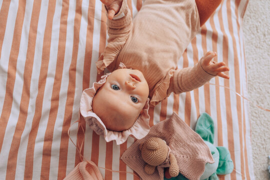Baby learning to turn on tummy 