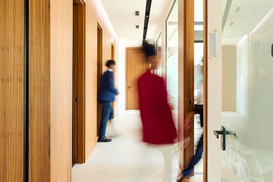 Business people on the move through the corporate space