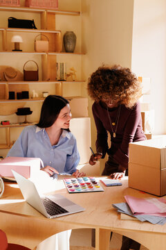 Teamwork in a Small Business Store Office with Laptop