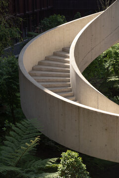 Architectural spiral stairs surrounded by greenery