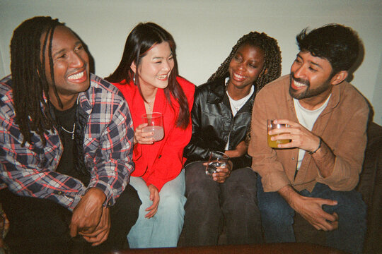 Film photo of friends at home party 