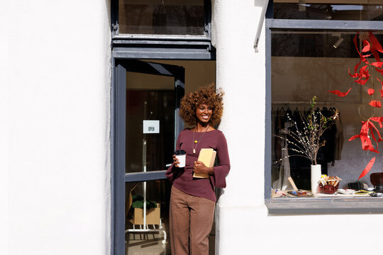 Portrait Woman with Coffee Outside Small Business Store