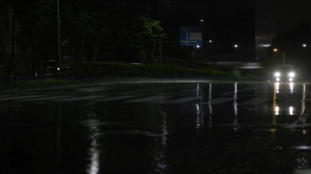 Tokyo,Japan - June 9, 2026: Lens flare from a car headlight in the heavy rain