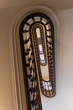 ertical view through classic spiral staircase