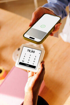 Business payment with smartphone and card reader in store