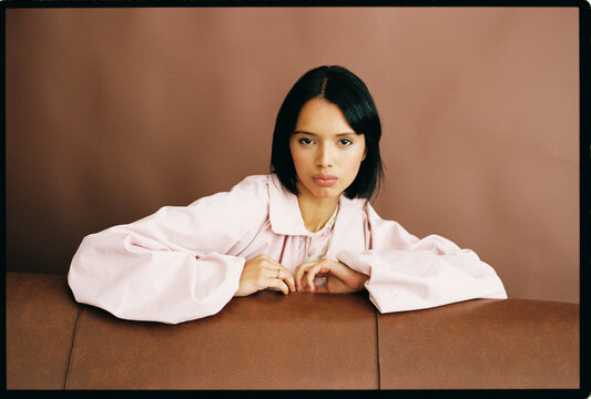 Woman leaning on sofa