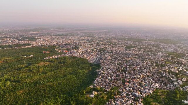 Dense overpopulation and urban development destroying green cover.