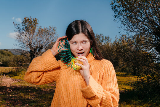 Portrait of Girl Playing With a Spring Toy