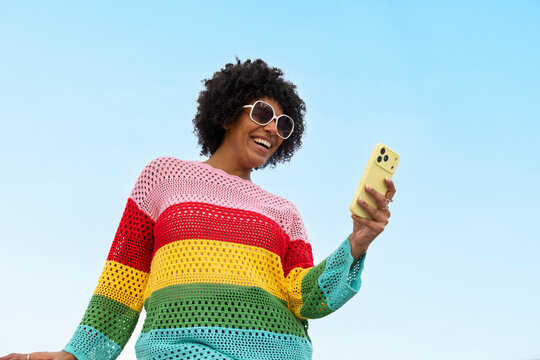 Black woman Fashion smile Portrait cell phone in hand 