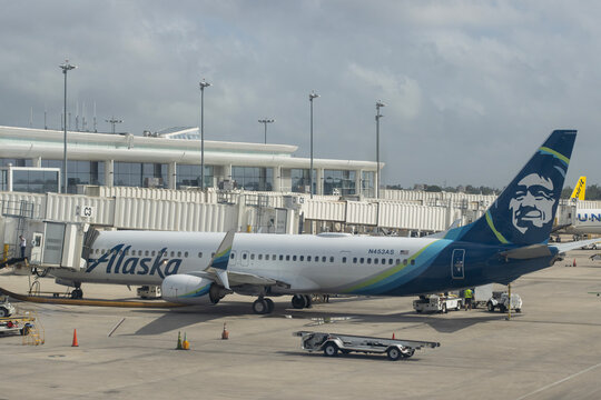 Kenner, LA, USA - Apr 5, 2025: A Boeing 737-990ER aircraft operated by Alaska Airlines is seen parked at a terminal gate in Louis Armstrong New Orleans International Airport (MSY).