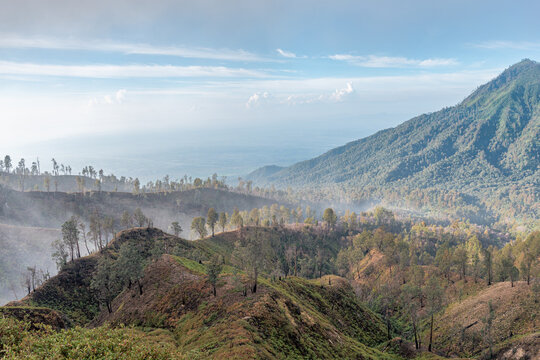Misty mountain landscape with layered hills in Indonesia