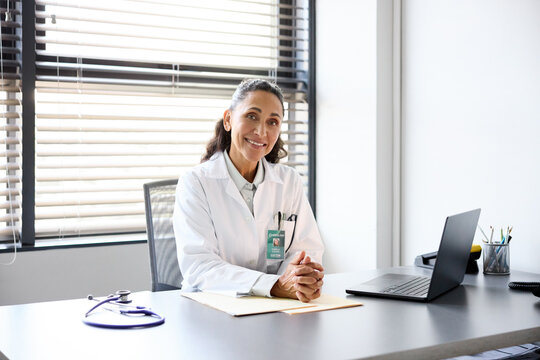 Portrait of a doctor sitting in her medical office.