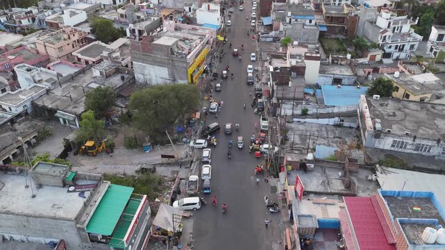 JAMMU, INDIA - JUNE 2026: Aerial drone hyperlapse over the bustling Janipur Chowk intersection.