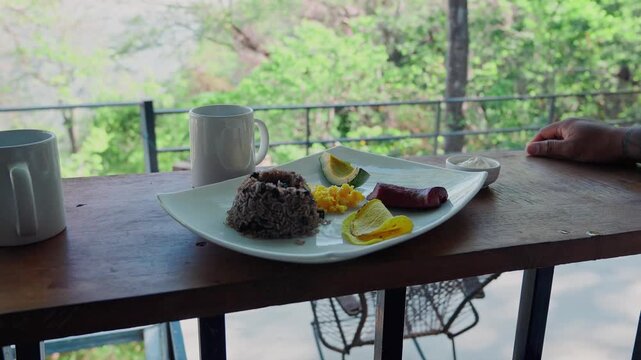 Traditional costa rican gallo pinto breakfast enjoyed in nature
