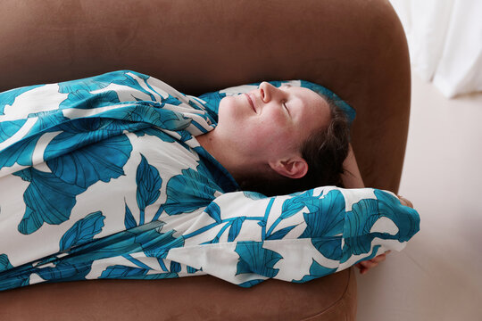 Carefree Woman Chill Peacefully on Sofa