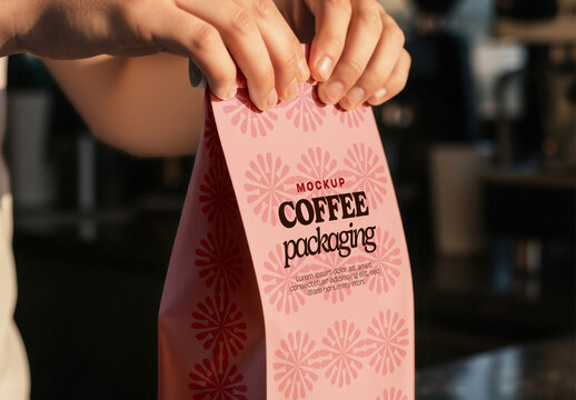 Hand Holding Coffee Flat Bottom Bag Mockup
