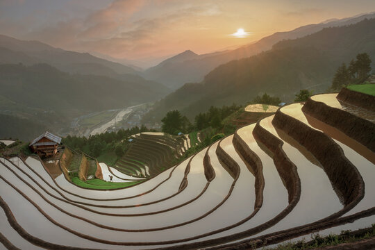 Sunrise over layered terraces