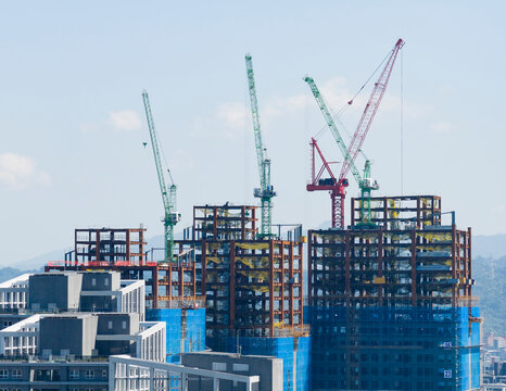 Tower Cranes at Urban Highrise Construction Site