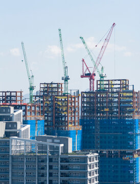 Tower Cranes at Urban Highrise Construction Site