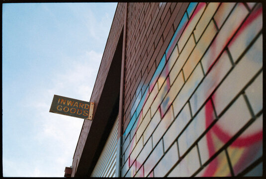Vintage Sign Above a Brick Wall